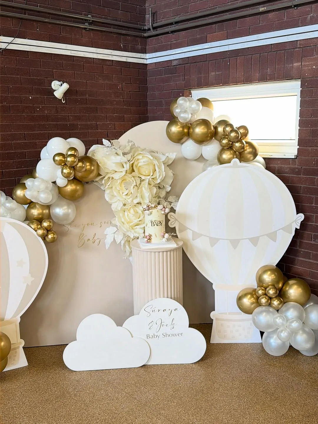A hot air balloon themed baby shower display