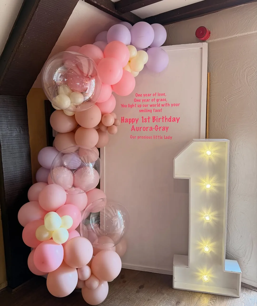 Blush and lilac garland with a light up number 1
