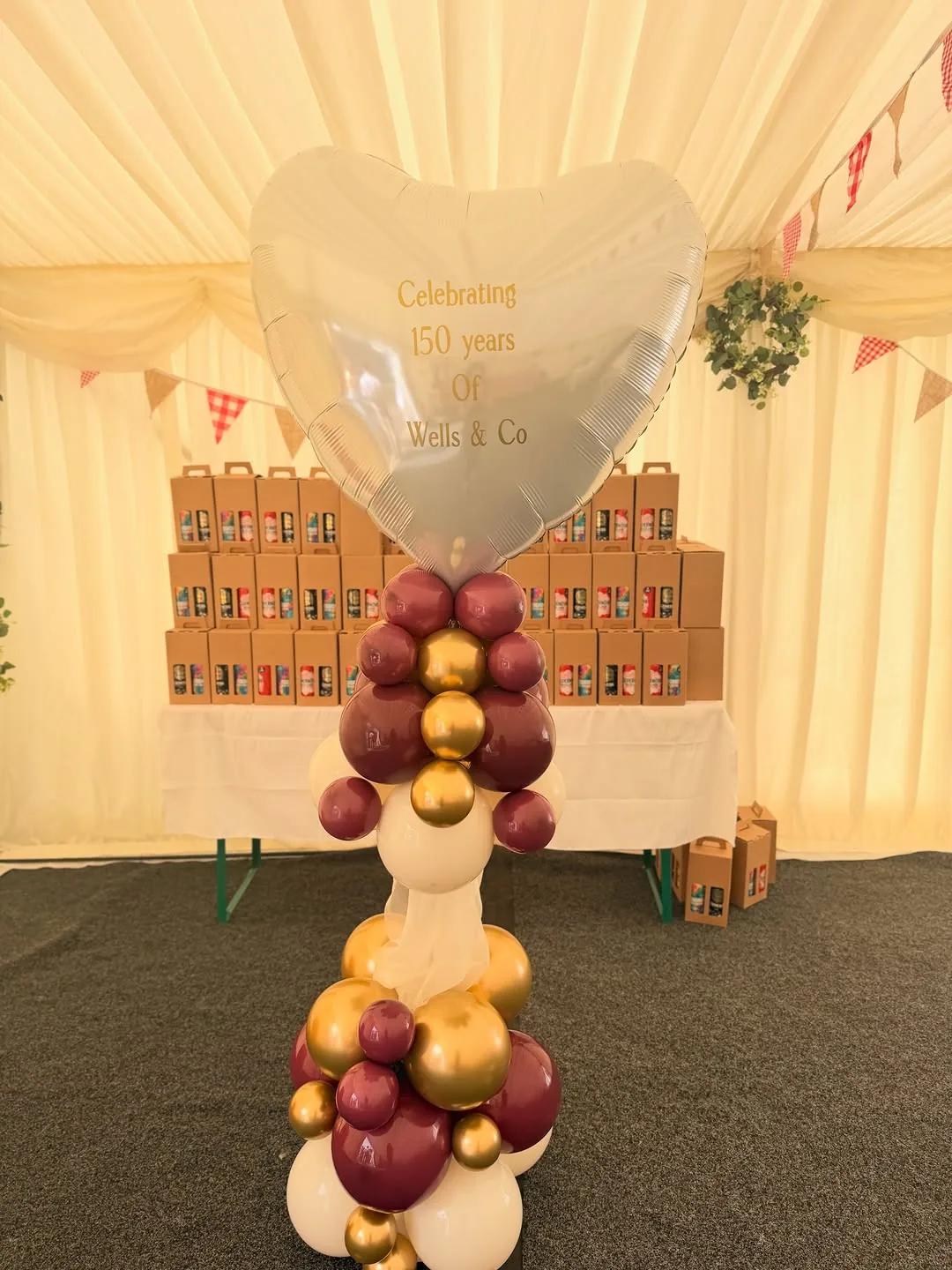 A Wells and Co 150 years corporate balloon display