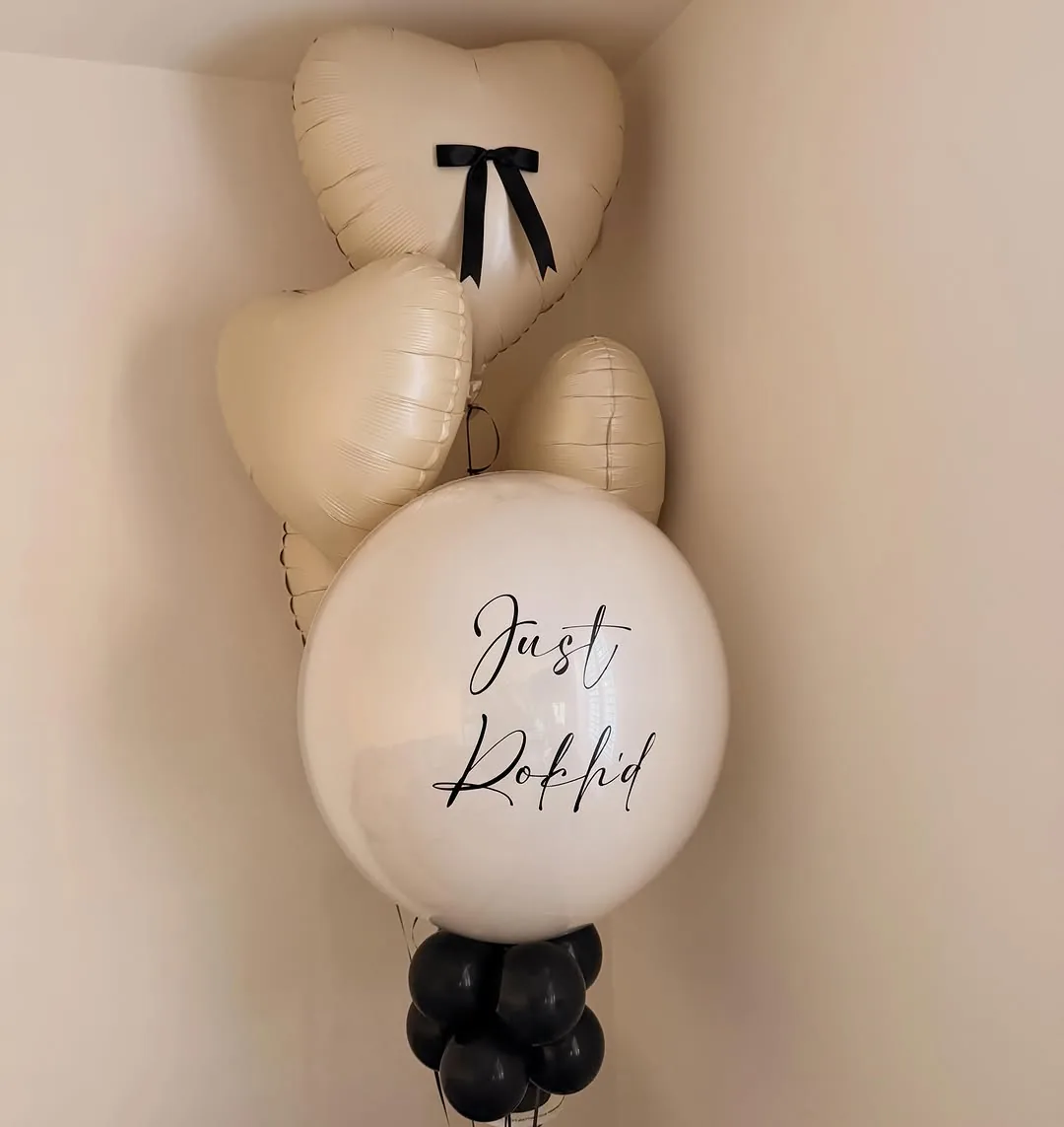 Ivory heart balloons arranged as a display