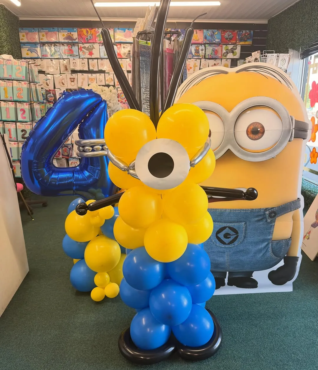 A Minions themed number four balloon display