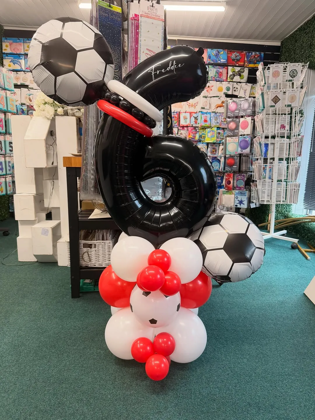 A football themed number six balloon display