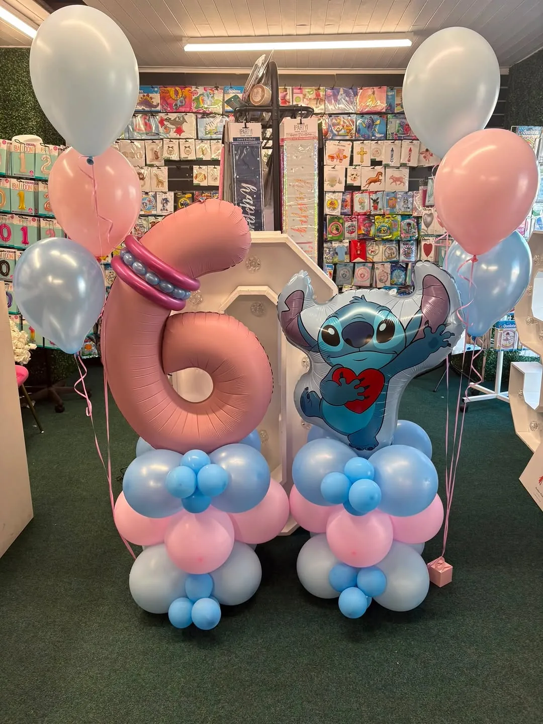 A Stitch themed number six balloon display