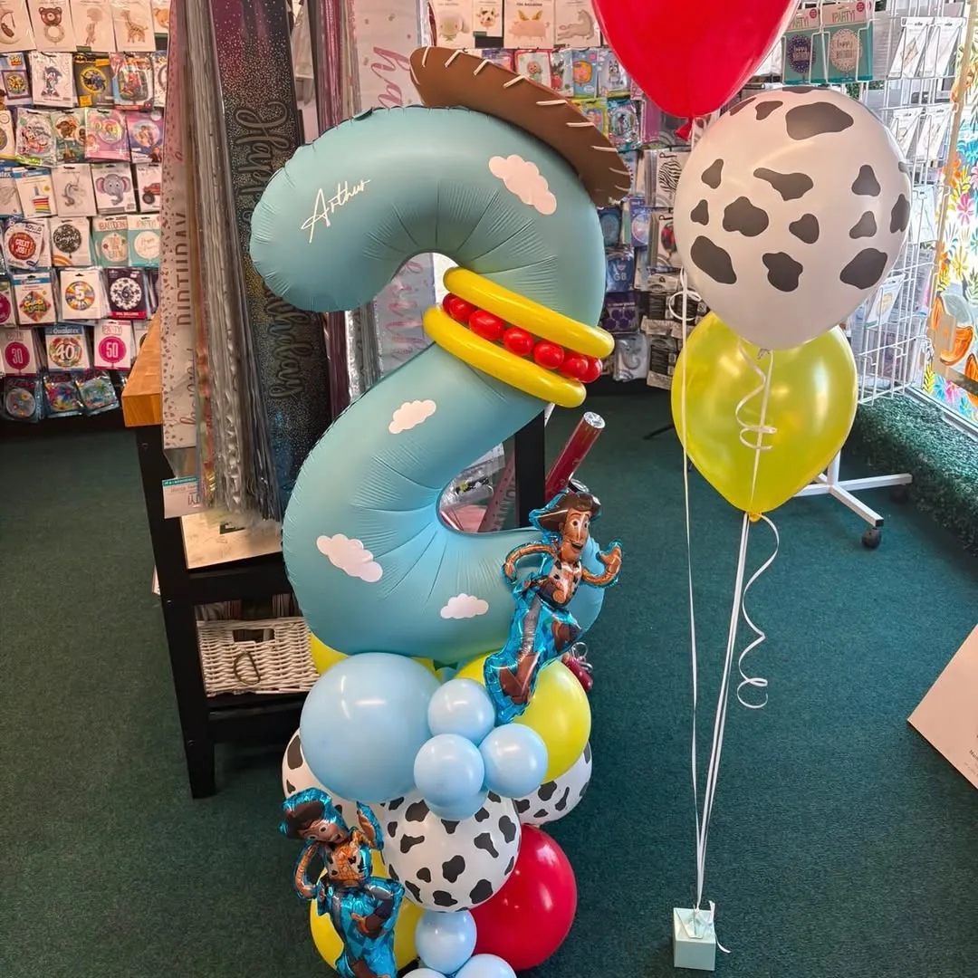 A Toy Story themed number seven balloon display