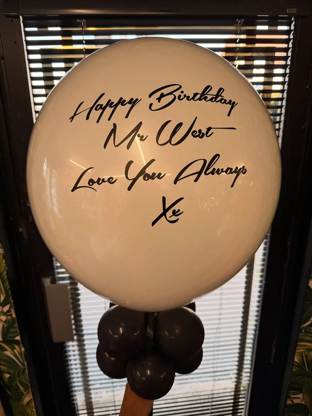 A large personalised hand written birthday balloon