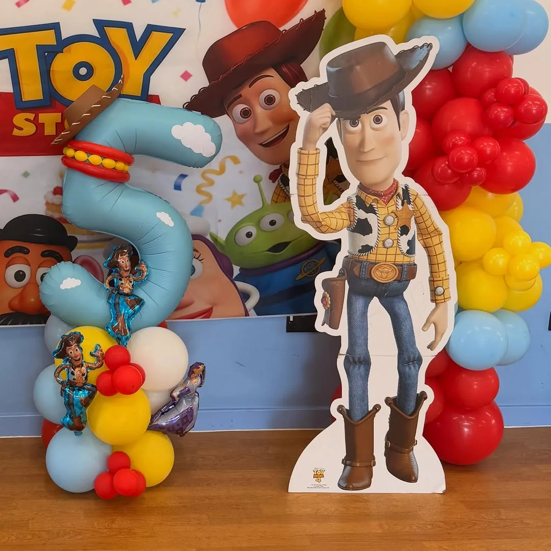 A Toy Story themed number five with character cutouts