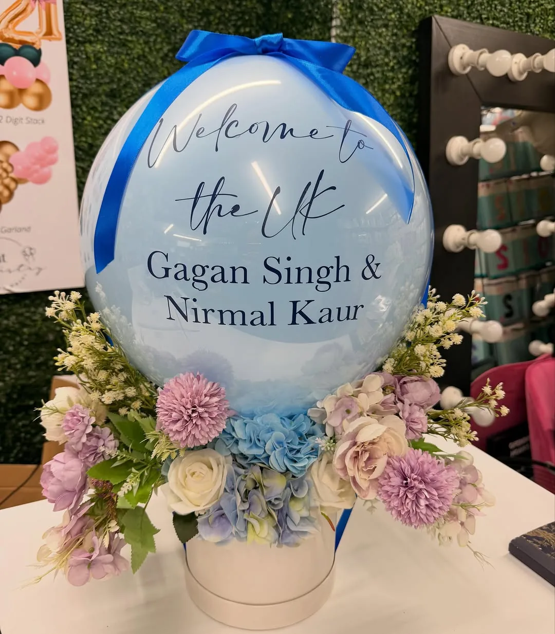 A personalised welcome bubble balloon with flowers
