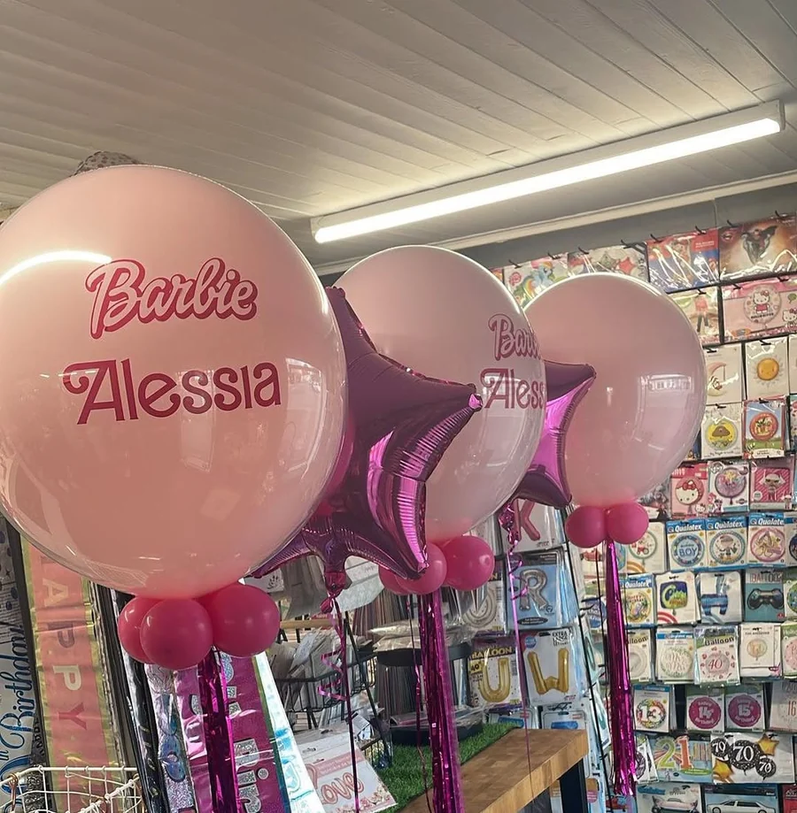 A personalised pink bubble balloon made up in the shop